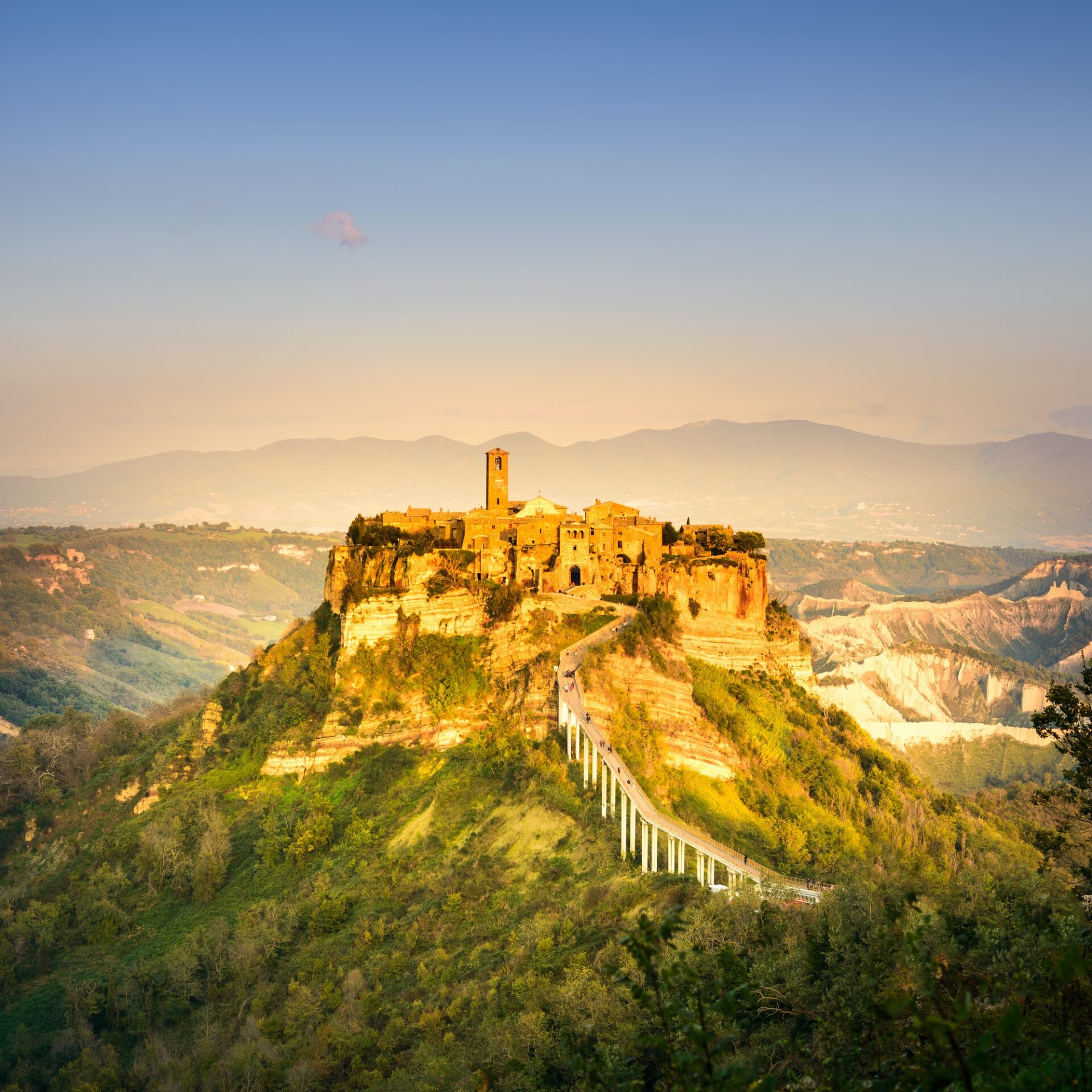 Civita di Bagnoregio landmark, aerial panoramic view on sunset. Italy